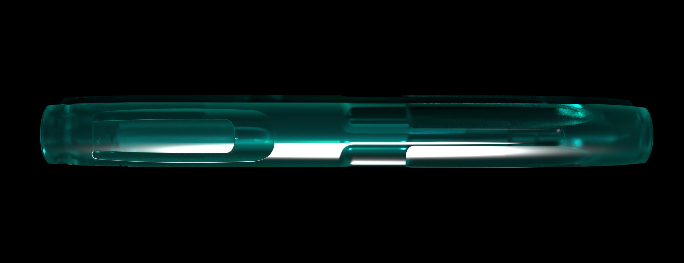 The Ode Pen in the dark, light glowing through the emerald resin at the tag end
